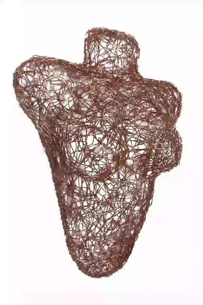 Wall sculpture of a female bust made of copper